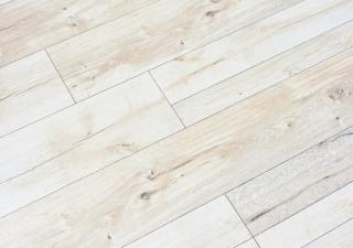 close up image of cream coloured laminate flooring